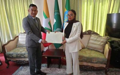 U Aung Min Oo presents copy of his Credentials to Aziza Geleta, Director General of Protocol Affairs, Ministry of Foreign Affairs of Ethiopia